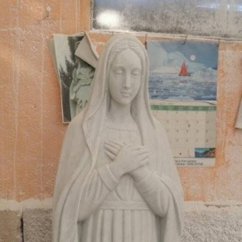 Madonna mani al petto